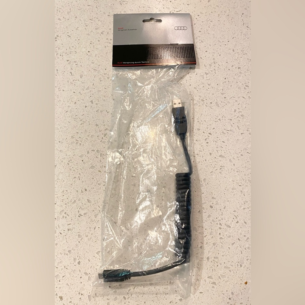 Audi original cell phone charger cord NWT. Never used this one. USB to micro USB